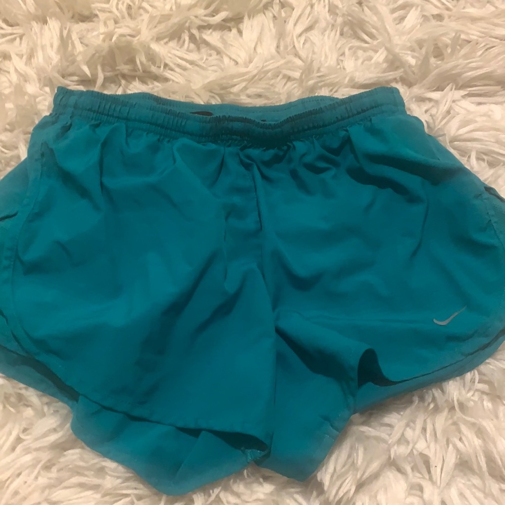 Teal Nike running shorts